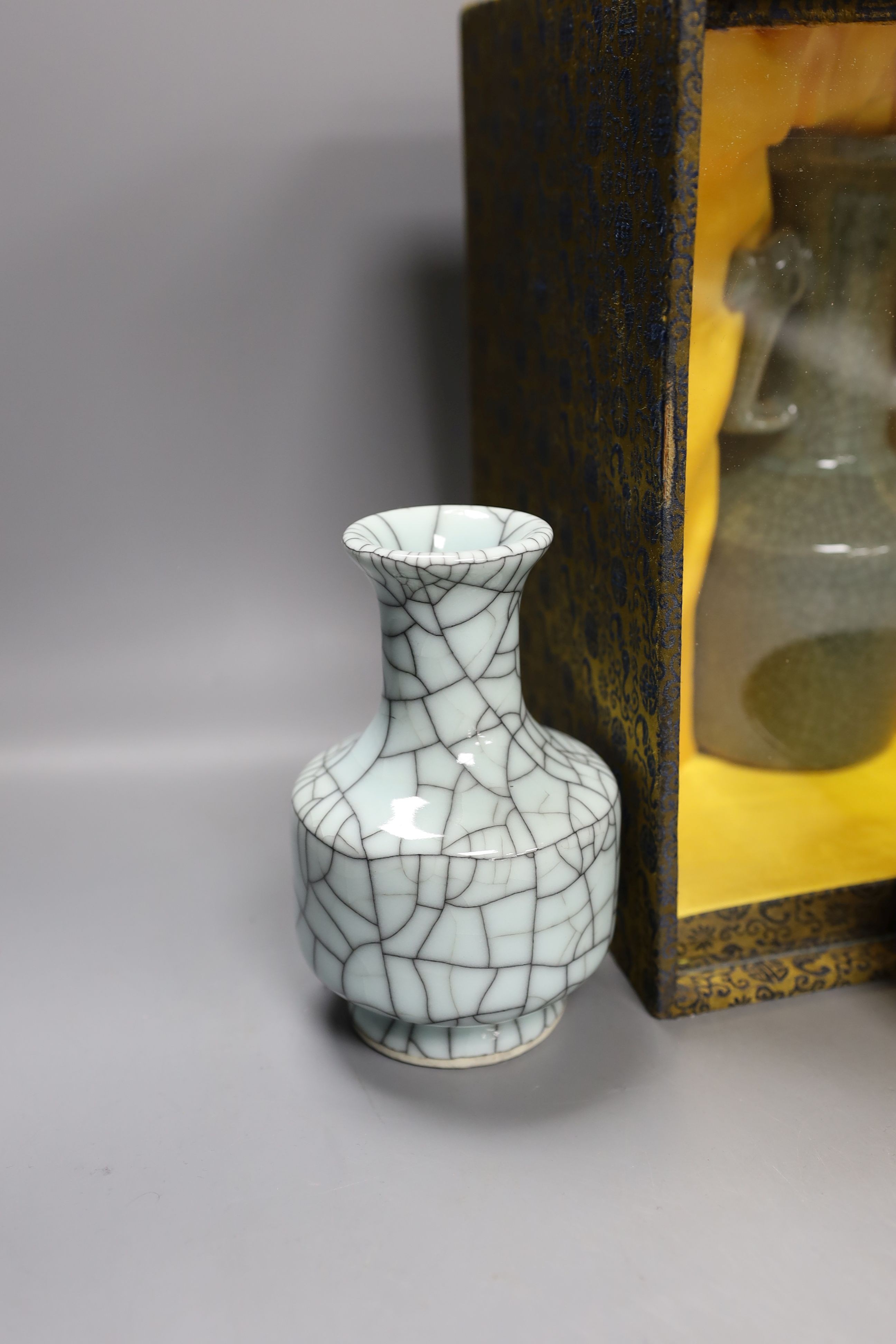A group of Chinese monochrome ceramics, comprising two crackle glaze vases, tallest 21 cm, one cased, a Jun type dish and tripod censer a leaf impressed bowl and another bowl